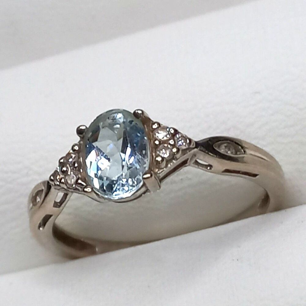 10K White Gold Aquamarine Ring with 6 Diamonds, 3 on each side  Size 7